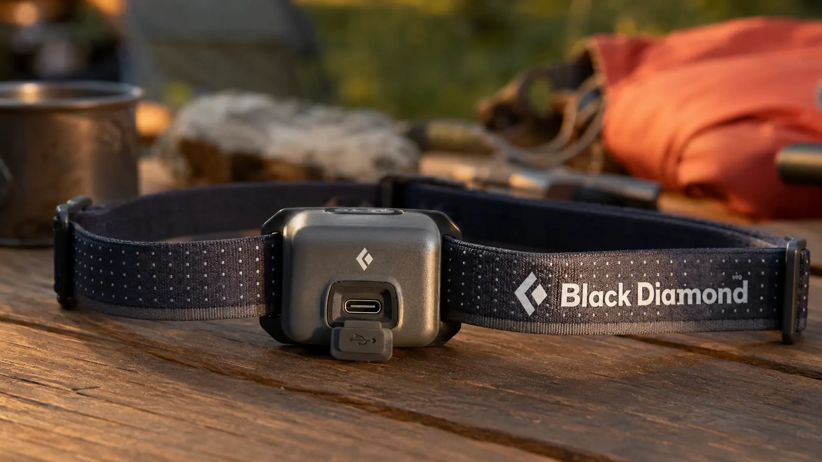 Close-up of the Black Diamond Spot 400 headlamp mounted on a head strap showing the locking button